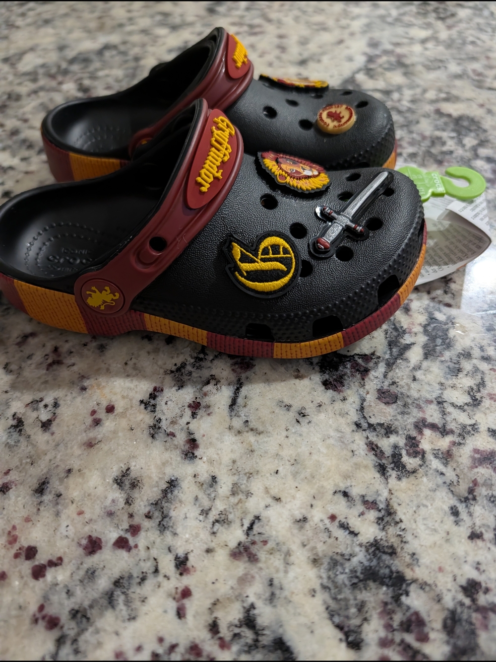 Crocs Kids Harry Potter Gryffindor Classic Clogs featuring themed Jibbitz charms